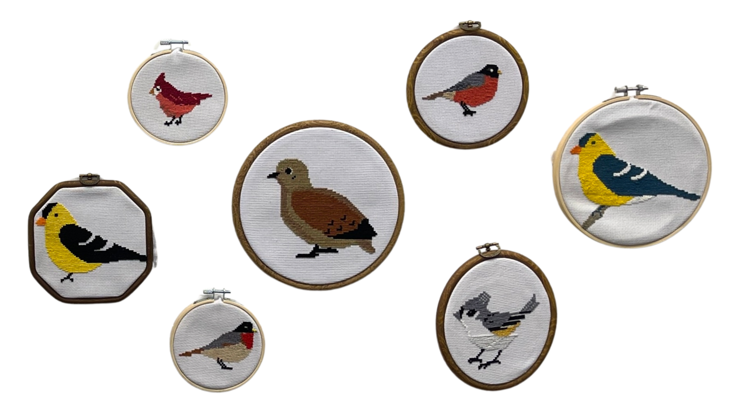 framed embroidery works of birds