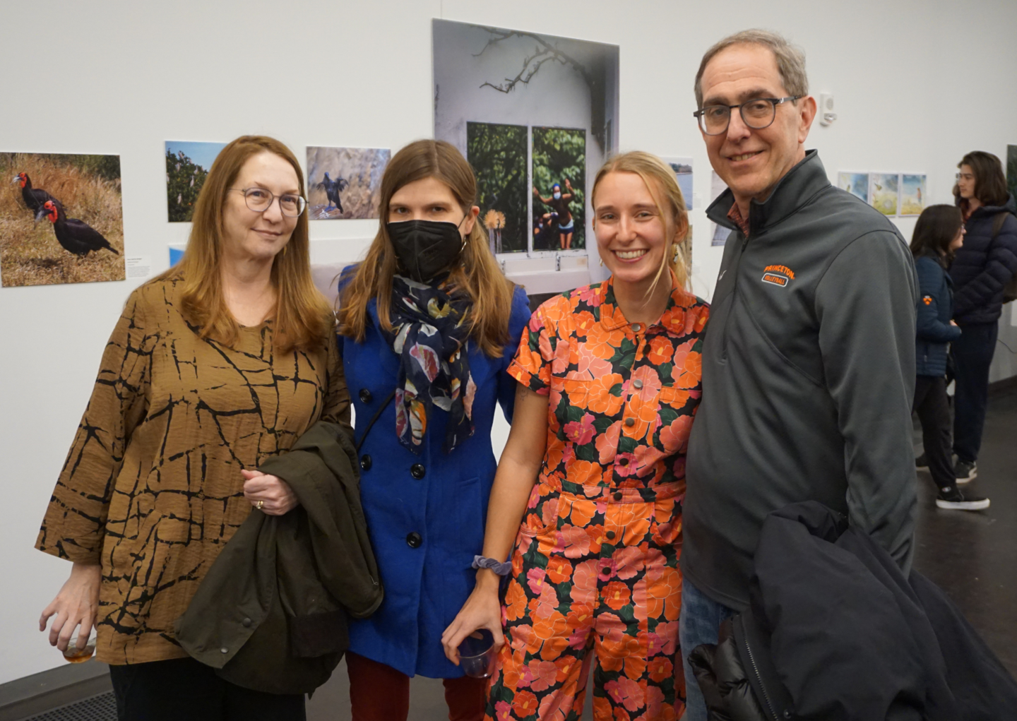people smiling for photo in gallery