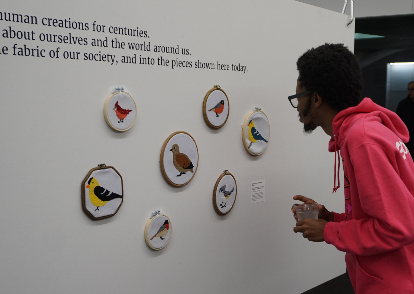 person looking at exhibition art