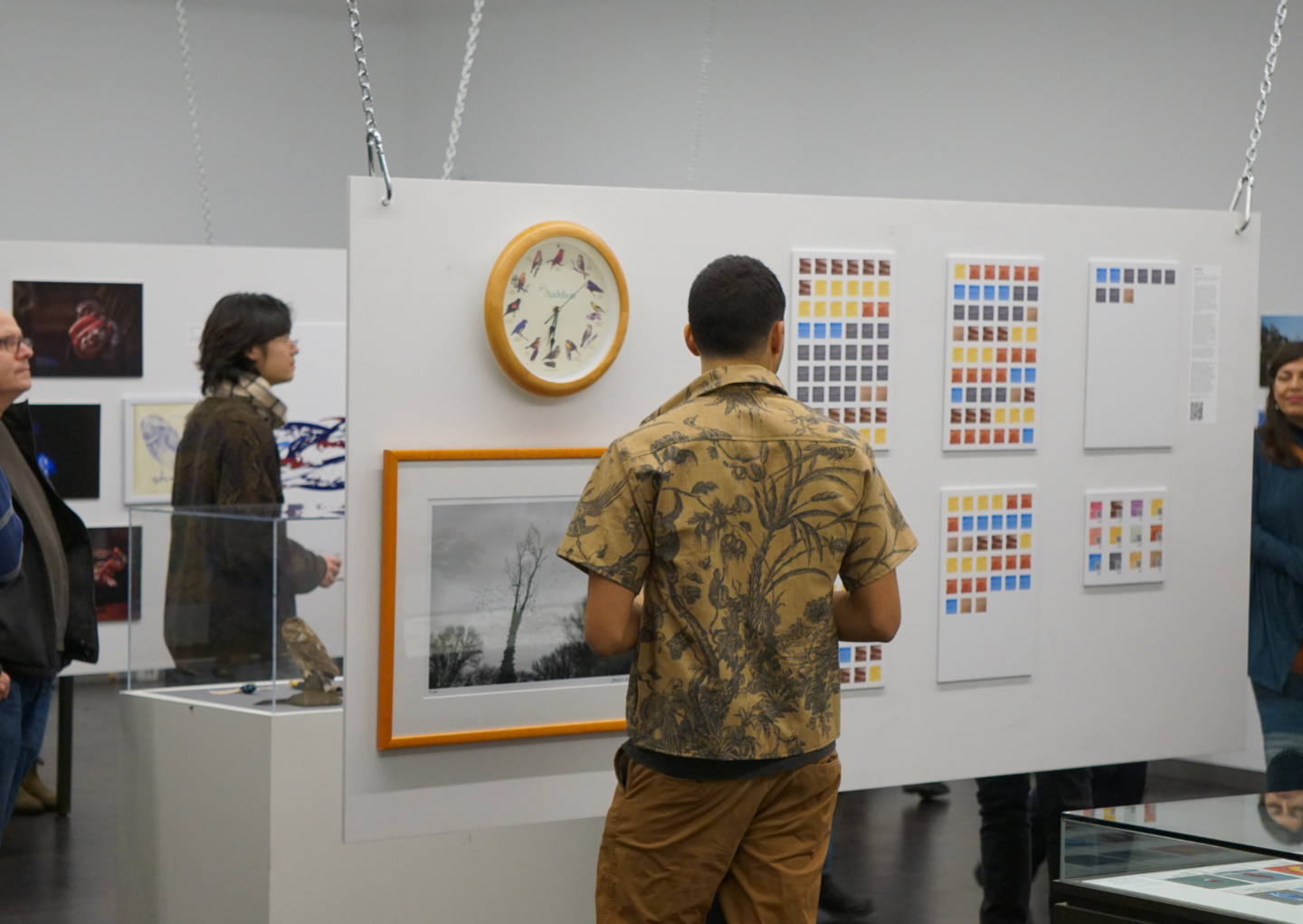 people looking at exhibition art