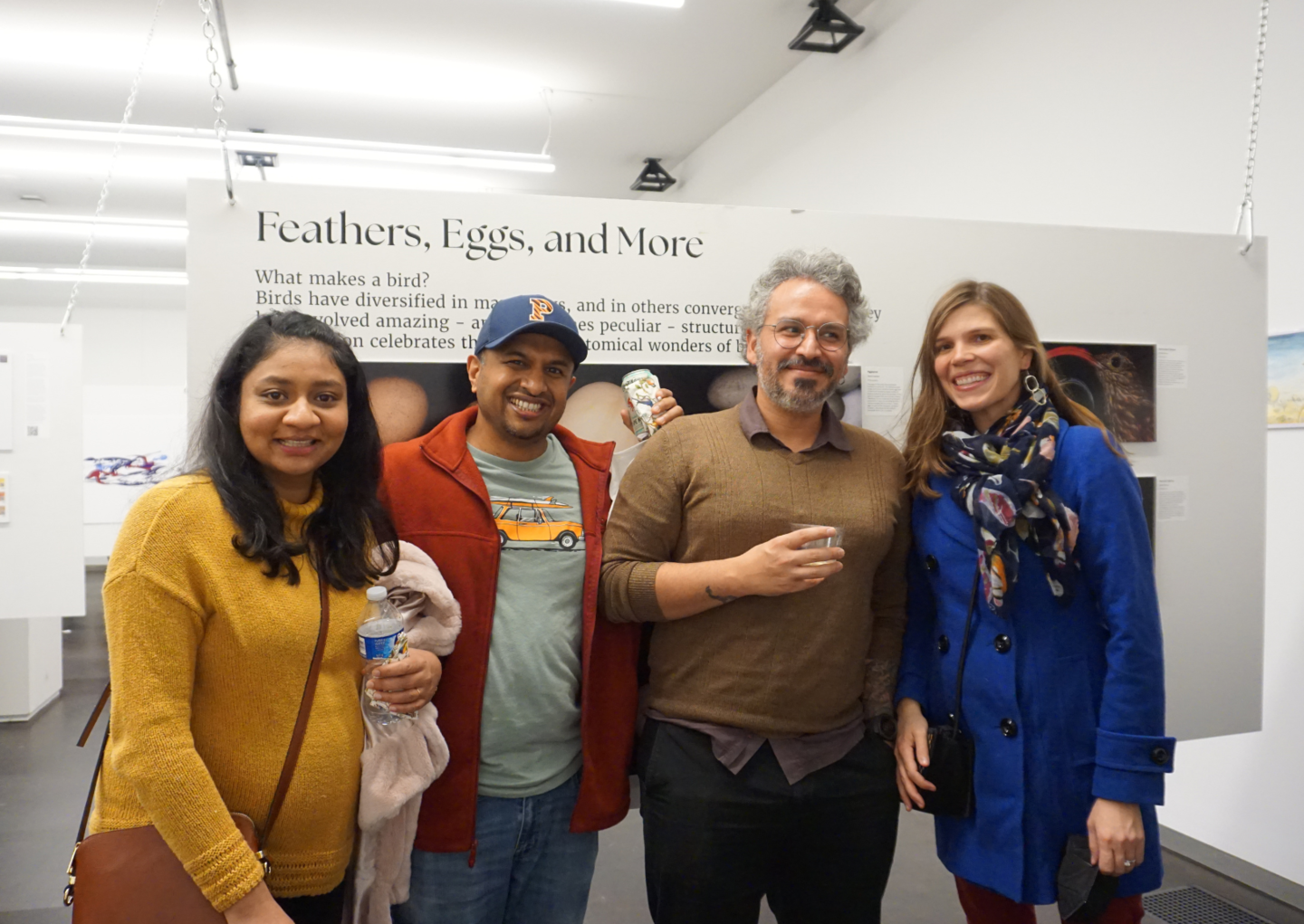 people smiling for a photo in the gallery