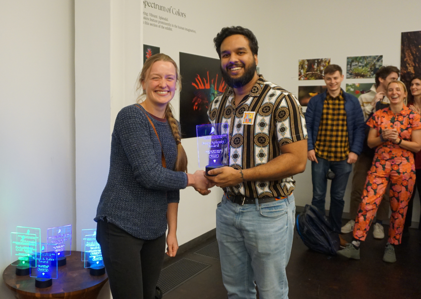 an award recipient receiving their trophy