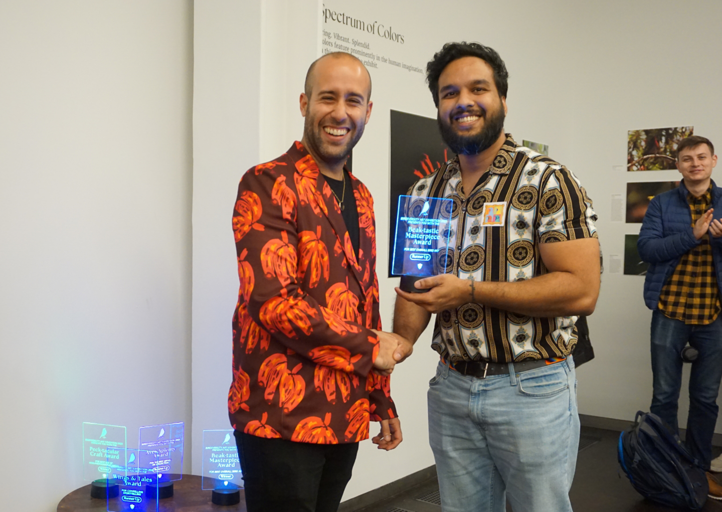 an award recipient receiving their trophy
