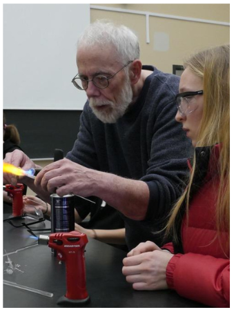 Mike Souza teaching student about glass