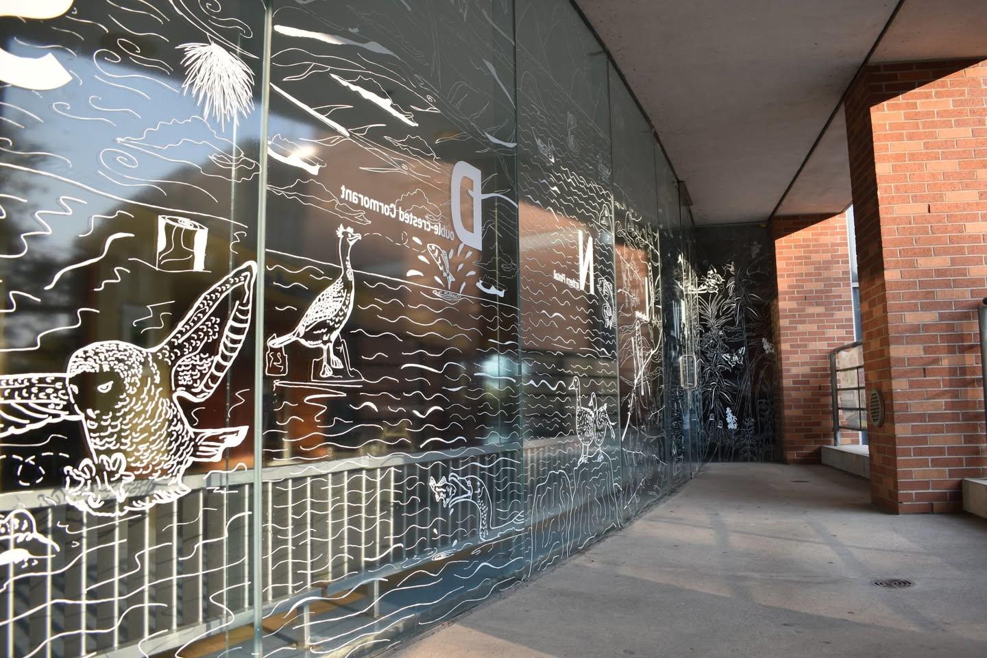 bird decal linework design installed on a window