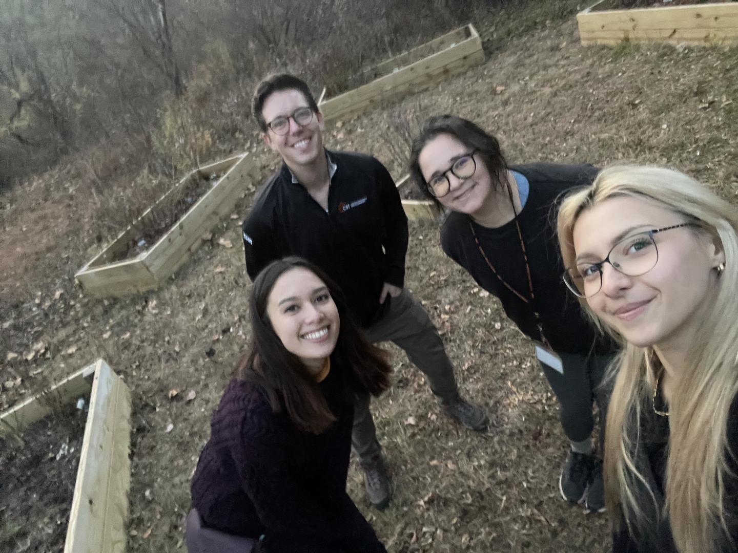 planters of the pollinator garden taking a selfie