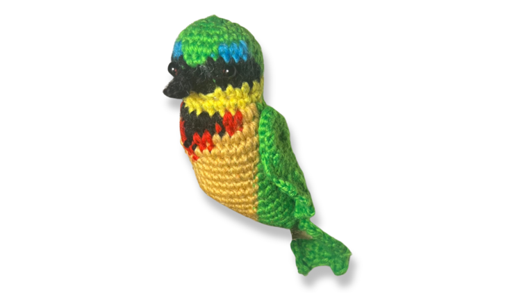 a colorful bee eater made out of yarn